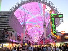 The Fremont Street Experience covered by the 1,500 foot long VivaVision canopy contains manyh casinos, shops and vintage neon.